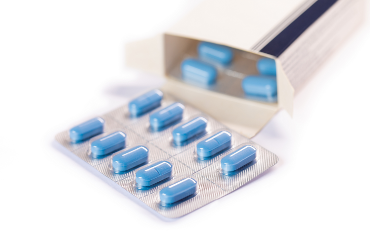 box of medication with blue tablets